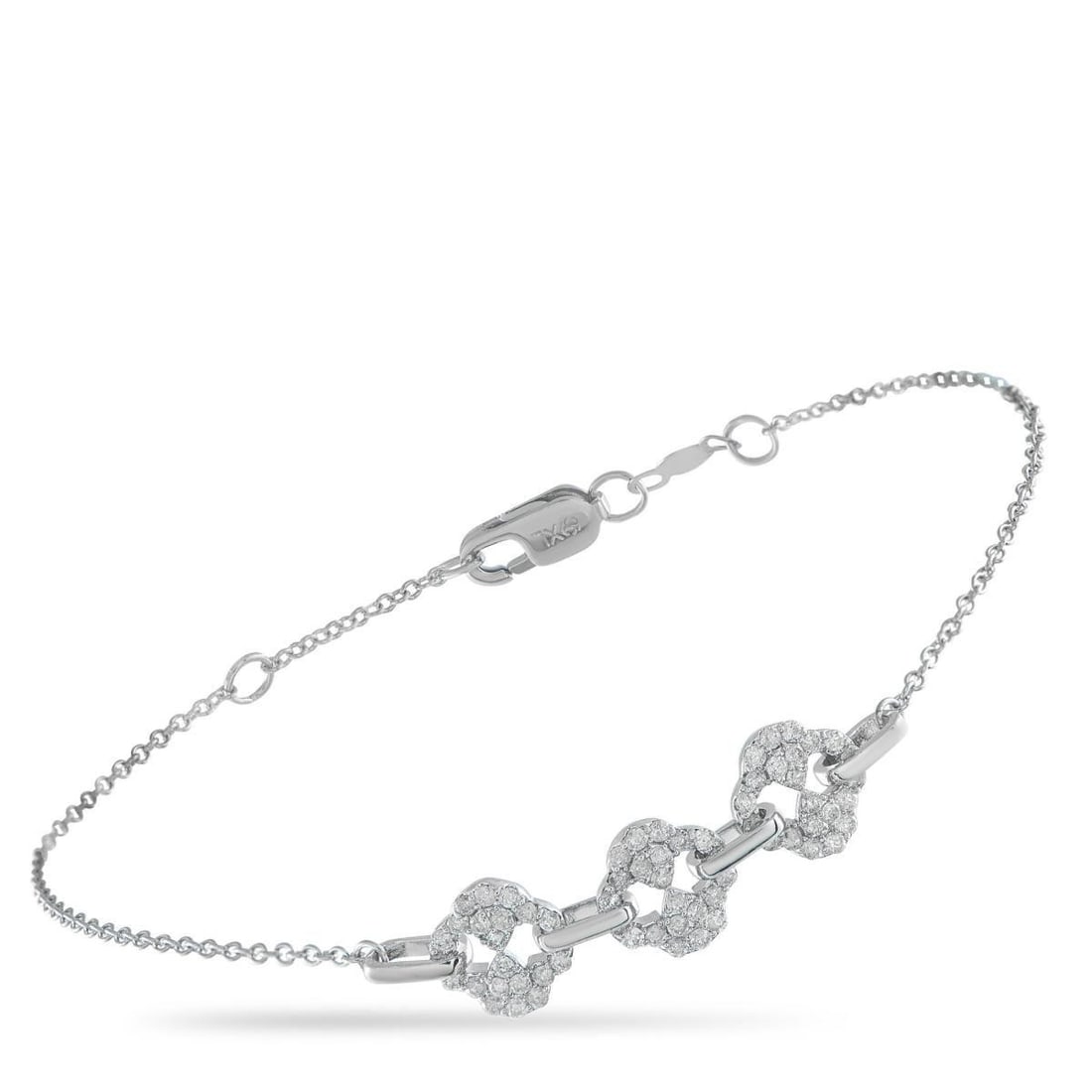 14K WHITE GOLD 0.40CT DIAMOND BRACELET: This elegant, understated bracelet is ideal for everyday wear. An arrangement of Diamonds totaling 0.40 carats sits at the center of this pieces delicate 7 chain. Crafted from 14K White Gold, it comes