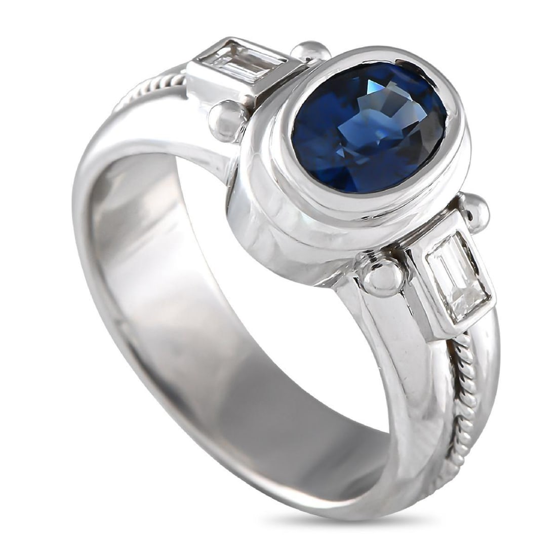 18K WHITE GOLD 0.32CT DIAMOND AND SAPPHIRE RING: This luxury ring is poised to put the perfect finishing touch on any ensemble. An ornate 18K White Gold setting sets the stage for this exquisite accessory. An oval-shaped 1.55 carat Sapphire makes a 
