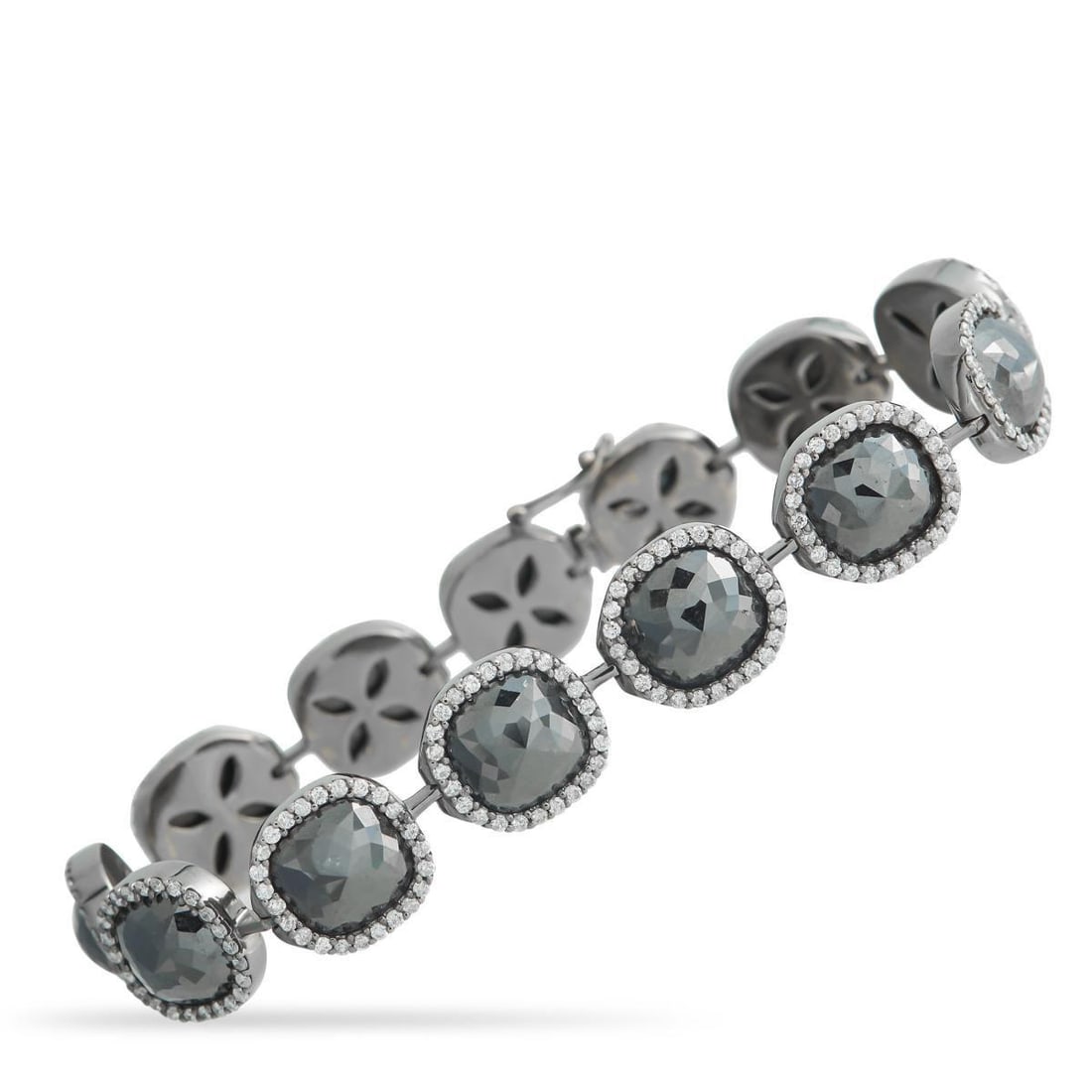 18K WHITE GOLD 32.95CT WHITE AND BLACK DIAMOND BRACELET: This luxury bracelet offers beautiful contrast. Glittering Black Diamonds with a total weight of 29.90 carats make a statement at the center, while White Diamonds totaling 3.05 carats provide addition
