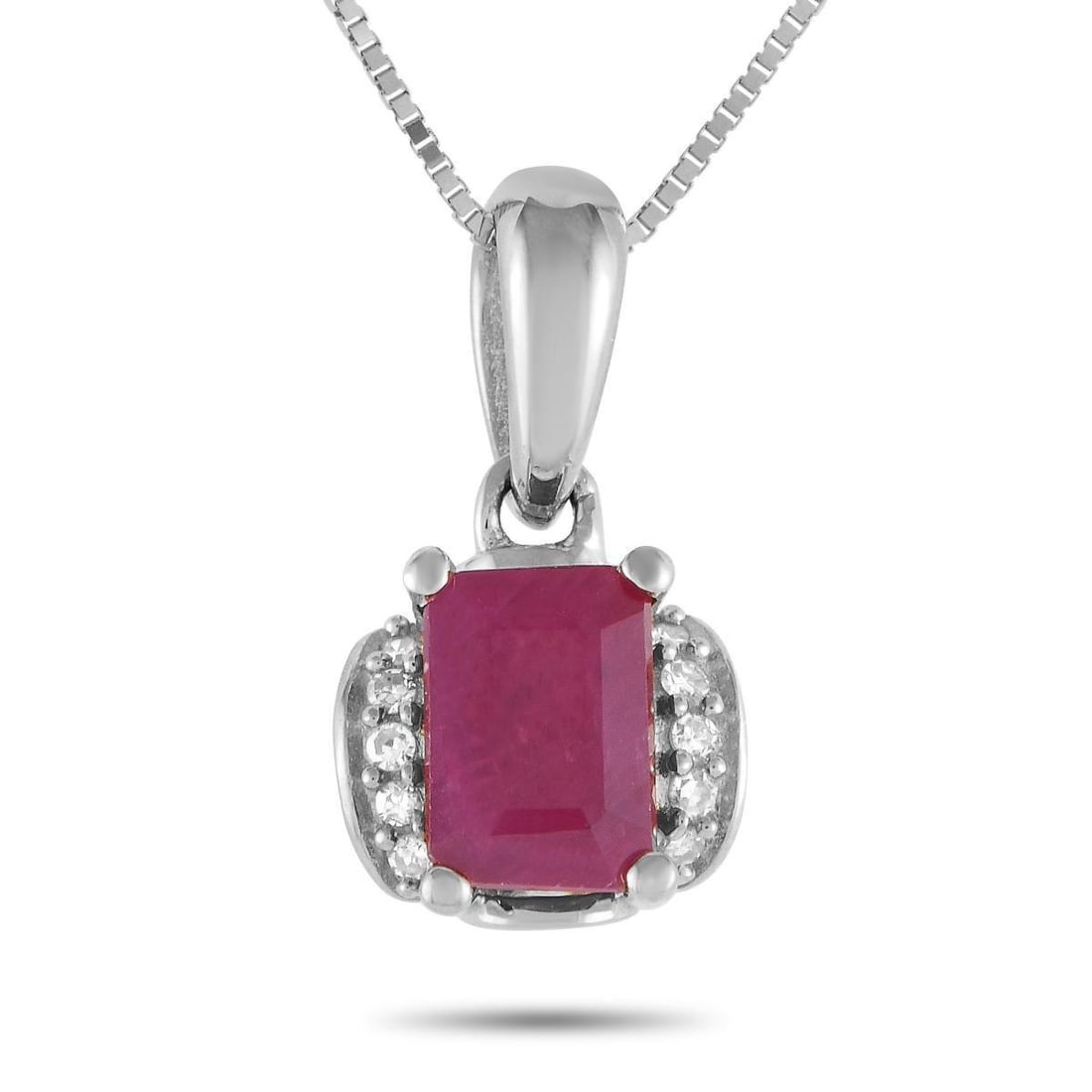 14K WHITE GOLD 0.03CT DIAMOND AND RUBY PENDANT NECKLACE: This luxurious necklace is inherently sophisticated. Suspended from a sleek 18 box chain, youll find a 14K White Gold pendant measuring 0.50 long by 0.25 wide. Diamonds with a total weight of 0.03 acc