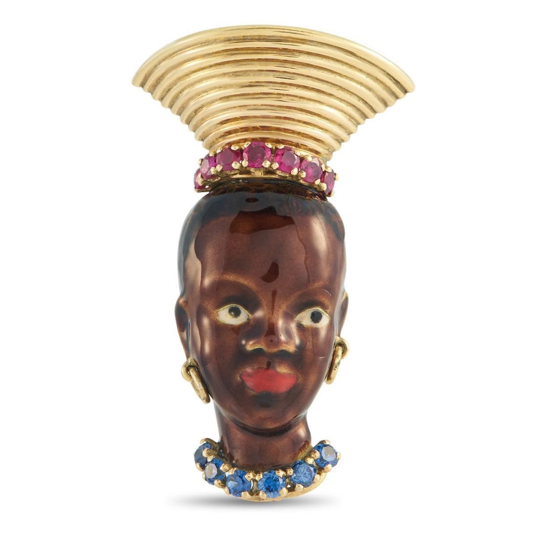 18K YELLOW GOLD SAPPHIRE, RUBY, AND ENAMEL FRENCH BLACKAMOOR BROOCH: This French Blackamoor brooch depicts an African woman in traditional headdress and opulent adornments. Crafted from 18K Yellow Gold, it features ruby, sapphire, and enamel accents. It measures 1.75 l