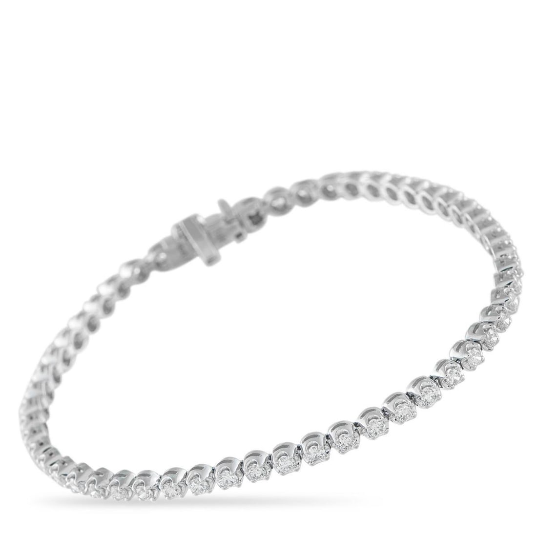 14K WHITE GOLD 2.38CT DIAMOND TENNIS BRACELET: Add sophistication to any ensemble with this radiant tennis bracelet. Simple, elegant, and perfectly understated, it shines to life thanks to a series of Diamonds totaling 2.38 carats. Its set in 14K 