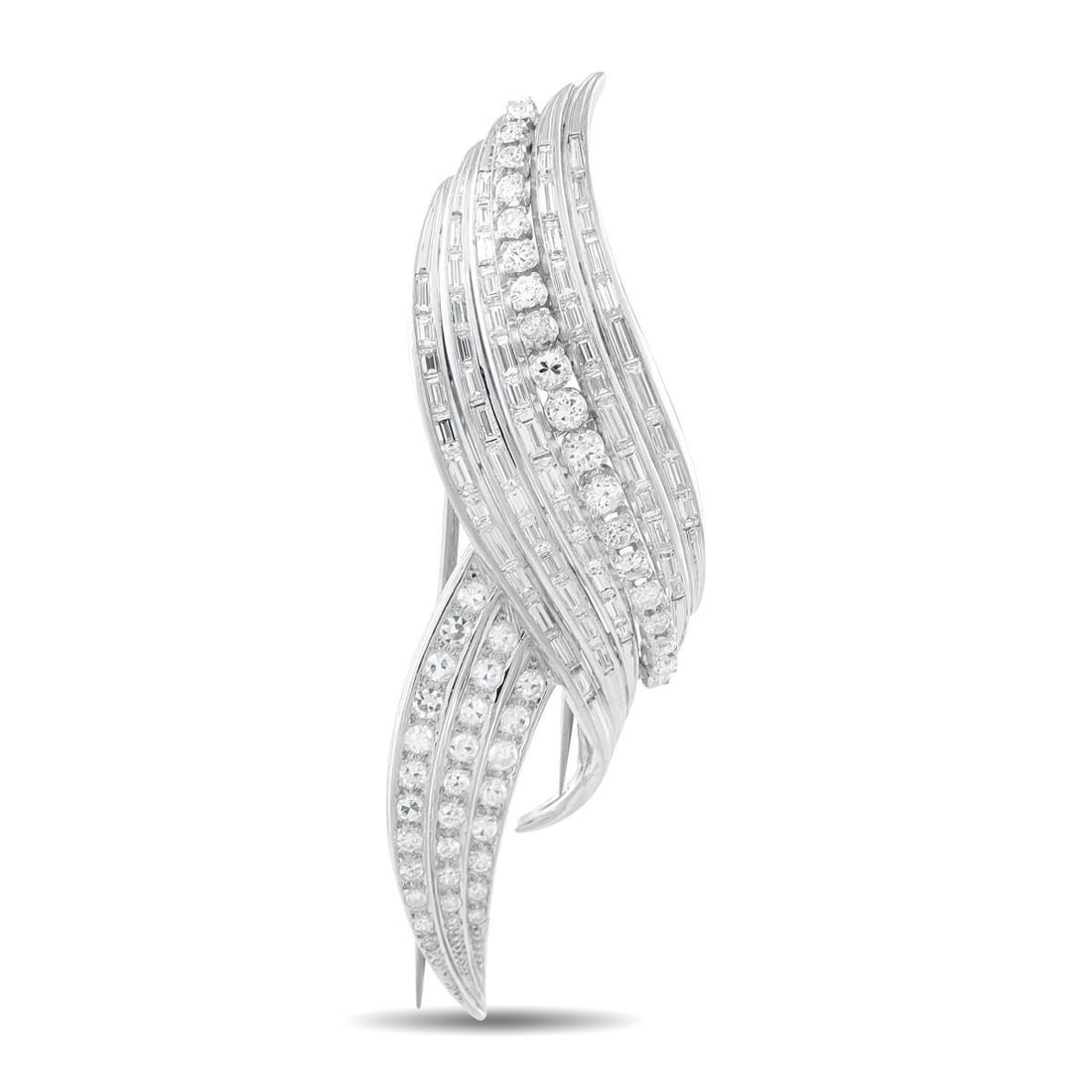 PLATINUM 7.25CT DIAMOND BROOCH: A gracefully curved Platinum setting provides this luxury brooch with an enduring design. The perfect accent to any ensemble, Diamonds with a total weight of 7.25 carats allow this piece to effortless
