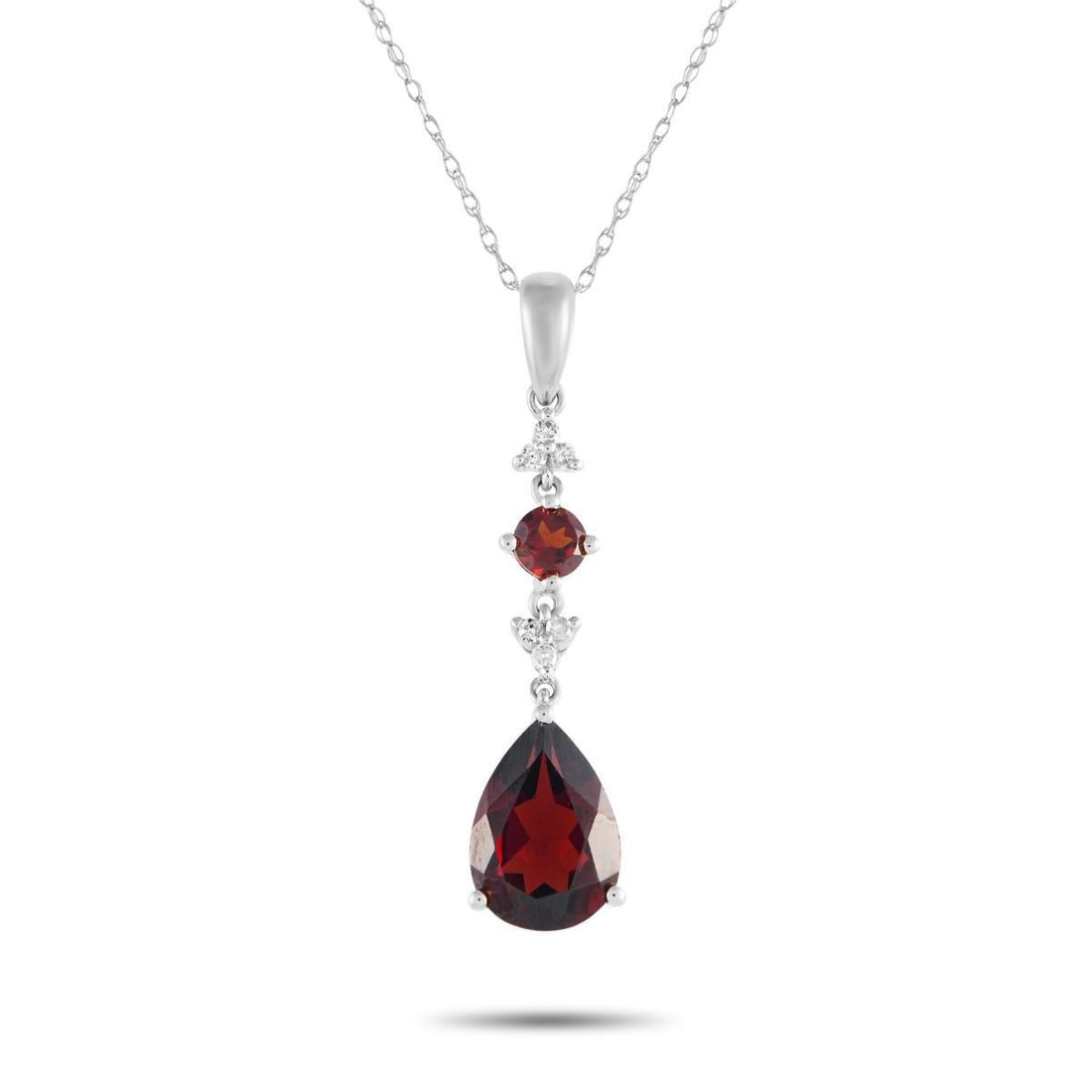 14K WHITE GOLD 0.05CT DIAMOND AND GARNET PENDANT NECKLACE: Add a stylish pop of color to any ensemble with this impeccably crafted necklace. Ideal for any occasion, this sophisticated accessory features a 14K white gold pendant measuring 1.25 long by 0.25 wid