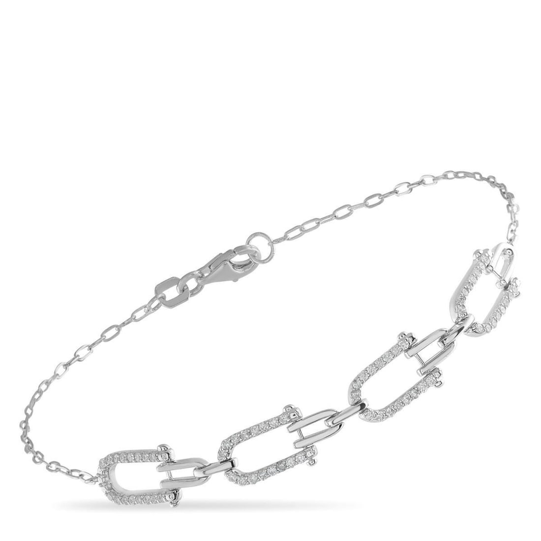 14K WHITE GOLD 0.25CT DIAMOND BRACELET: Interlocking links make this luxury bracelet impossible to ignore. Set in 14K White Gold, sparkling Diamonds totaling 0.25 carats highlight the uniquely elegant design. It measures 7.25 long.This jewe