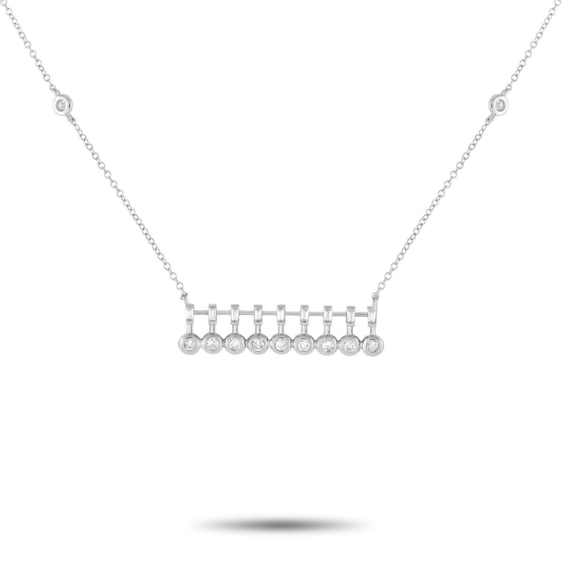14K WHITE GOLD 0.25CT DIAMOND BAR NECKLACE: A glittering jewel you can effortlessly take from office to dinner. This trendy piece features a 15 long chain with two bezel-set round diamond stations and a lobster clasp. It holds a horizontal pend