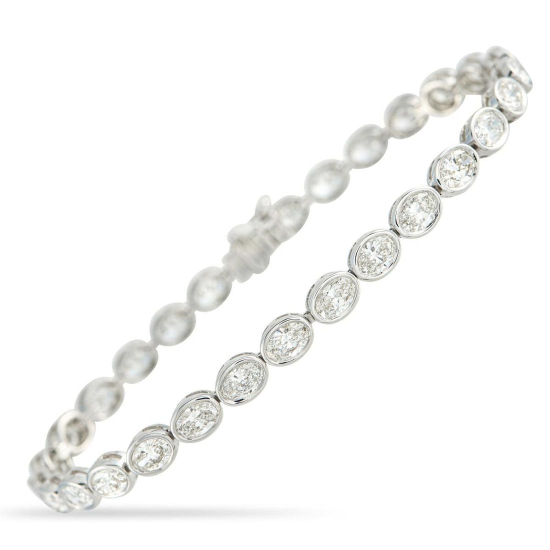 18K WHITE GOLD 7.25CT DIAMOND BRACELET: A series of sparkling Diamonds with a total weight of 7.25 carats makes this bracelet simply unforgettable. Simple, elegant, and perfectly understated, its crafted from 18K White Gold and measures 7.0