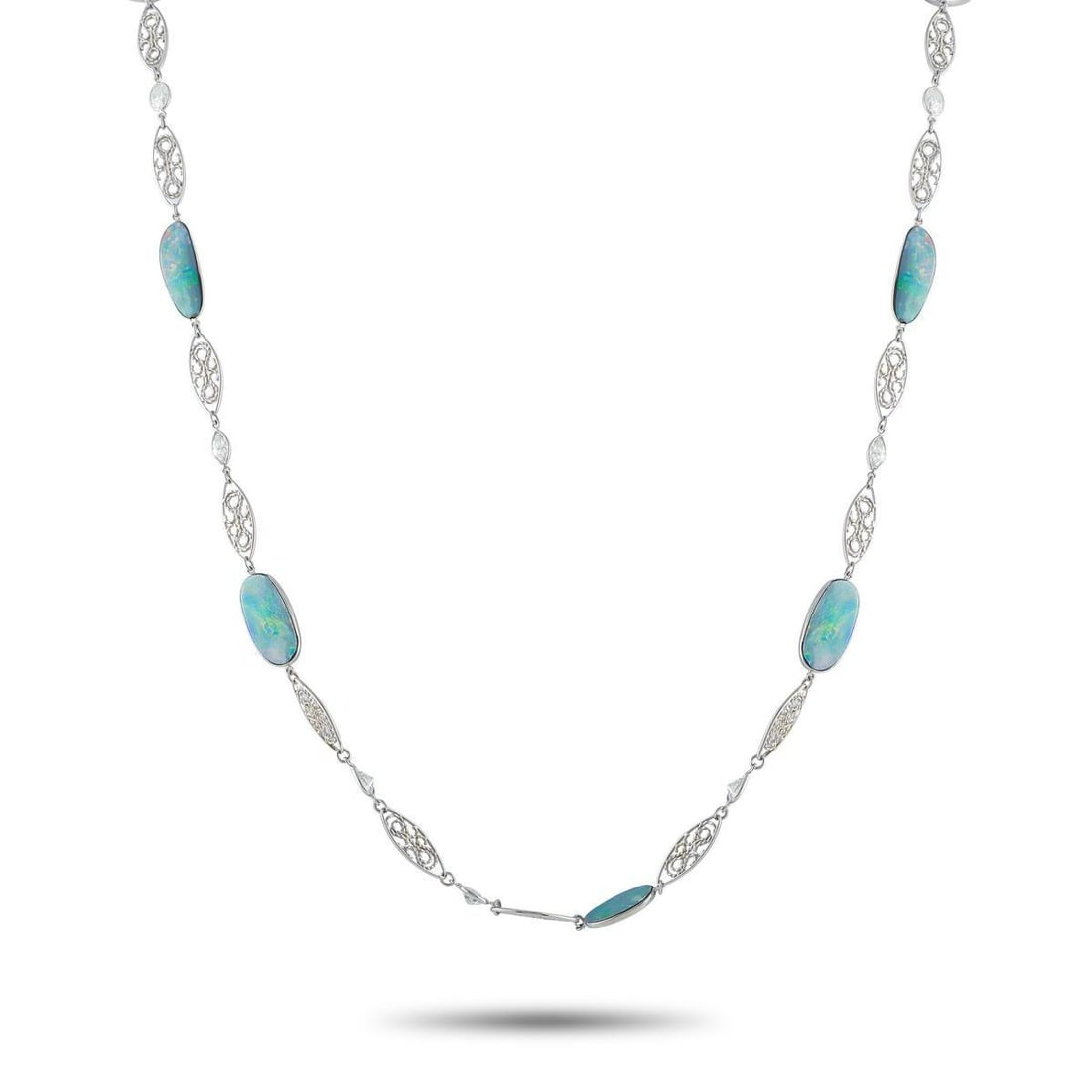 PLATINUM 5.50CT DIAMOND AND OPAL NECKLACE: This luxury necklace is filled with dynamic details. Intricate metalwork and sparkling Diamond accents totaling 5.50 carats elevate the overall design. Fiery blue Opal gemstones make it a unique acces