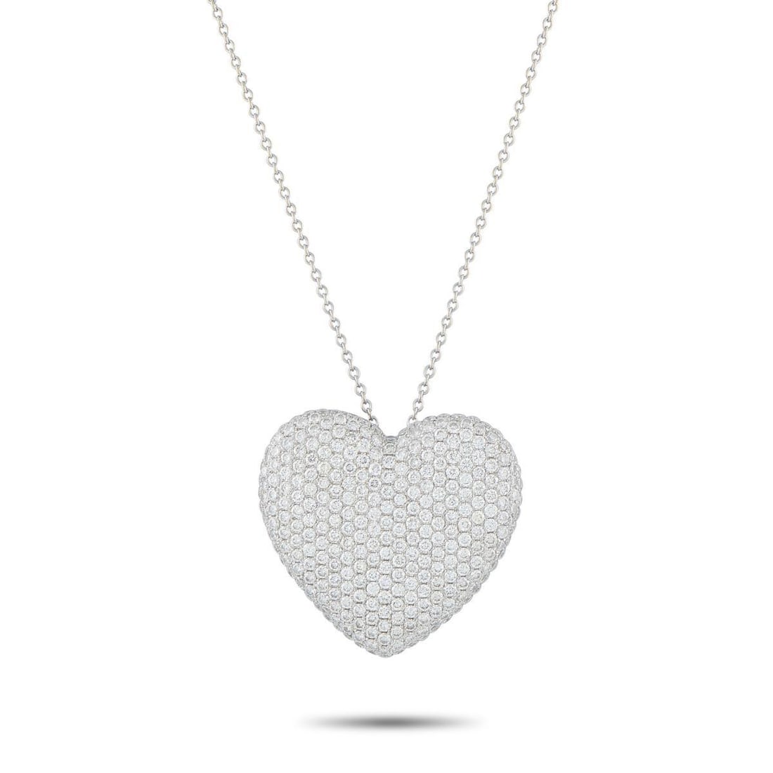 18K WHITE GOLD 3.10CT DIAMOND HEART NECKLACE: This dazzling necklace is as charming as it is elegant. Pave Diamonds with a total weight of 3.10 carats allow the heart-shaped pendant to continually catch the light. Crafted from 18K White Gold, the