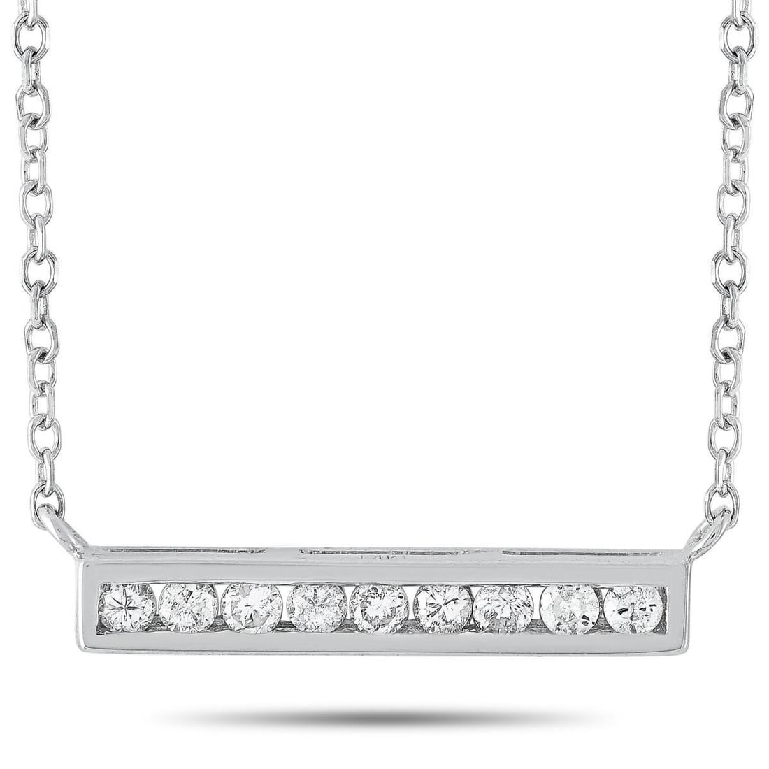 14K WHITE GOLD 0.10 CT DIAMOND PENDANT NECKLACE: This necklace is made of 14K white gold and embellished with diamonds that amount to 0.10 carats. The necklace weighs 1.5 grams and boasts a 15 chain and a pendant that measures 0.80 in length and 0.6