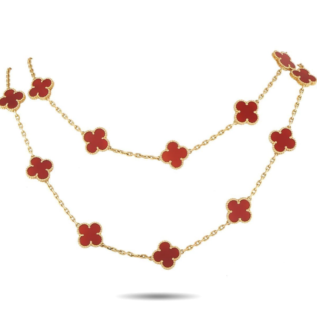 VAN CLEEF & ARPELS ALHAMBRA 18K YELLOW GOLD CARNELIAN 20-MOTIF NECKLACE: This exquisite Van Cleef & Arpels Alhambra necklace will continually impress. Crafted from 18K Yellow Gold, 20 of the brands iconic clover-shaped motifs come to life in rich reddish-orange Carnelian. 