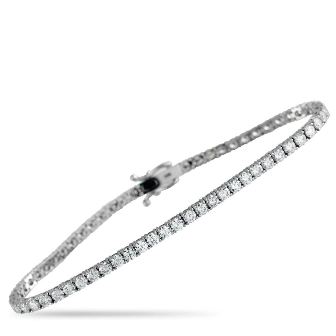 14K WHITE GOLD 5.05CT LAB-GROWN DIAMOND TENNIS BRACELET: Add a touch of luxury to any ensemble with this tennis bracelet. The understated 14K White Gold setting allows Lab Grown Diamonds totaling 5.05 carats to take center stage. This elegant accessory meas