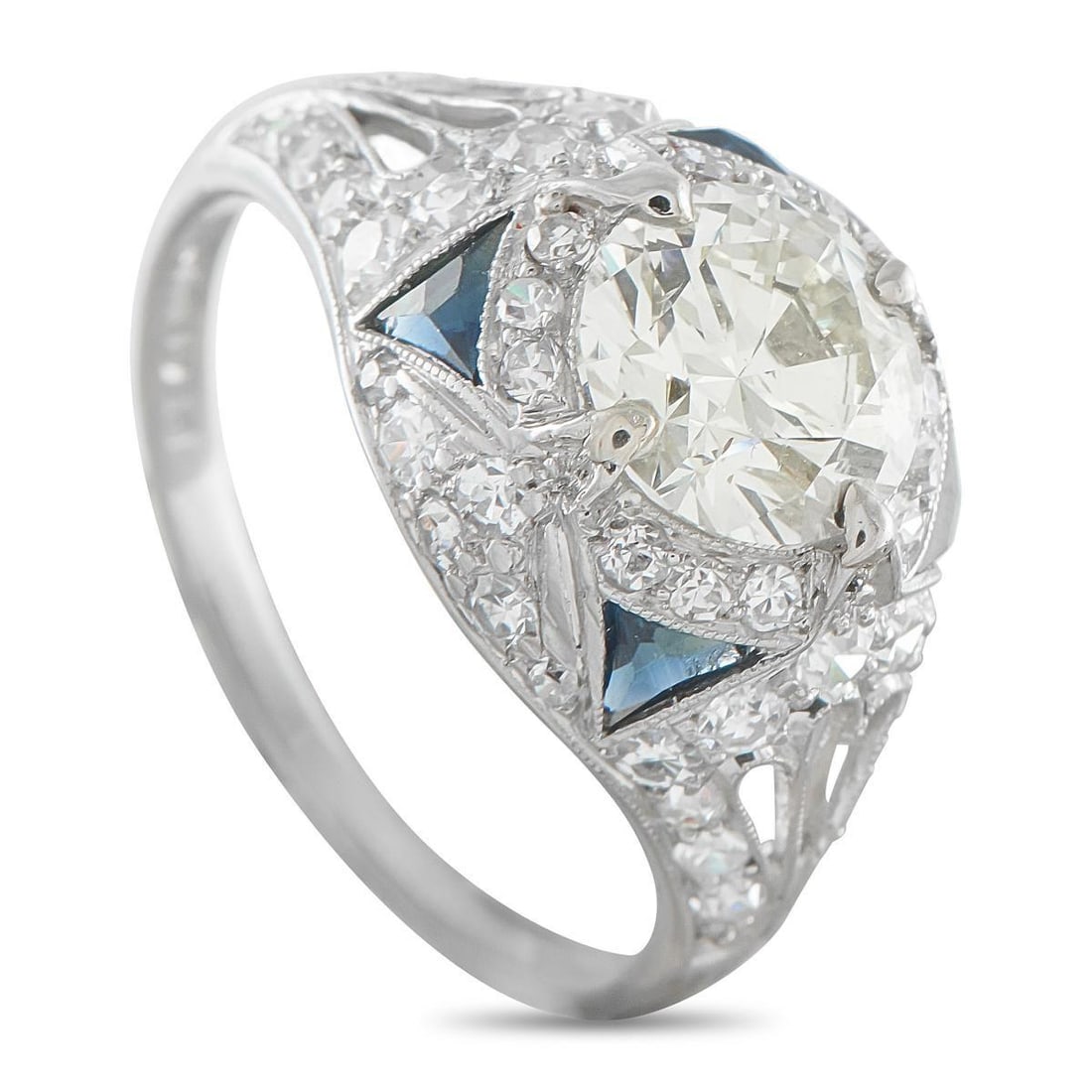 PLATINUM 2.0CT DIAMOND AND SAPPHIRE ART DECO RING: A timeless Art Deco design makes this luxury ring incredibly chic. The detailed Platinum setting provides the perfect backdrop for the 1.50 carat Diamond center stone. Additional Diamonds totaling 0.5