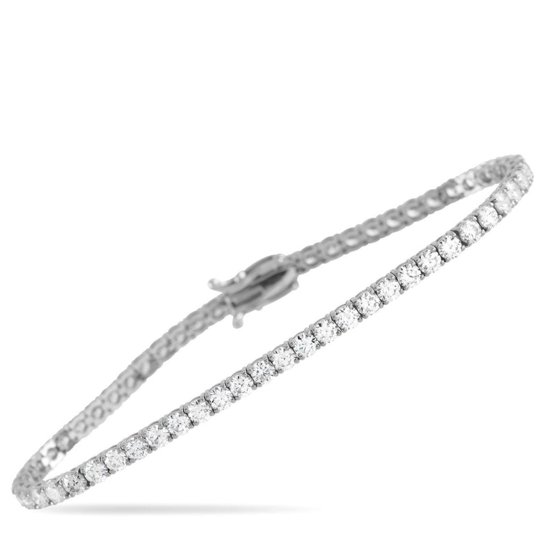 14K WHITE GOLD 6.0CT LAB-GROWN DIAMOND TENNIS BRACELET: This sparkling tennis bracelet is an instant classic. A series of Lab Grown Diamonds with a total weight of 6 carats make this the perfect way to add luxury to any ensemble. Set in 14K White Gold, it 