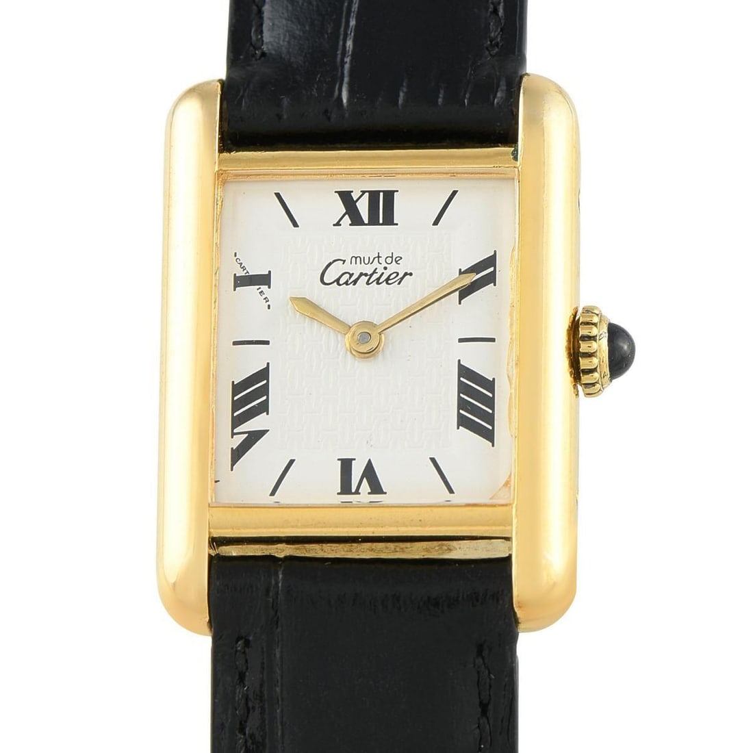 CARTIER MUST DE CARTIER TANK LOGO DIAL VERMEIL WATCH: This time-only Cartier watch you can pair with everything. This Must de Cartier has a gold-plated sterling silver case that frames a clean white dial where gold-toned sword hands sweep past Roman nume