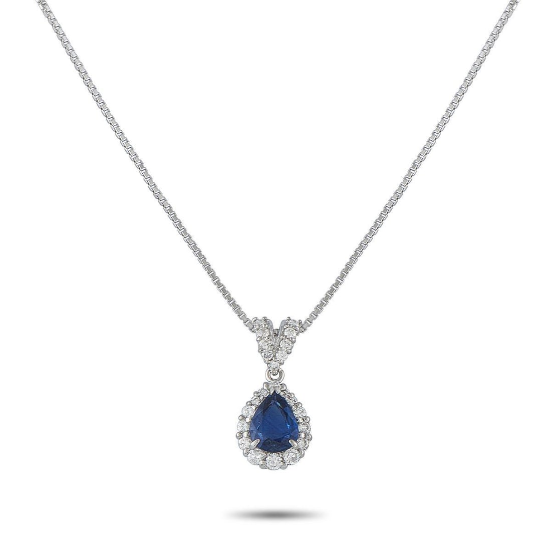 PLATINUM AND 18K WHITE GOLD 0.45CT DIAMOND AND SAPPHIRE PENDANT NECKLACE: This luxury necklace is simply exquisite. It features a 1.32 carat Sapphire surrounded by sparkling Diamonds totaling 0.45 carats. Crafted from a combination of Platinum and 18K White Gold, the pendan