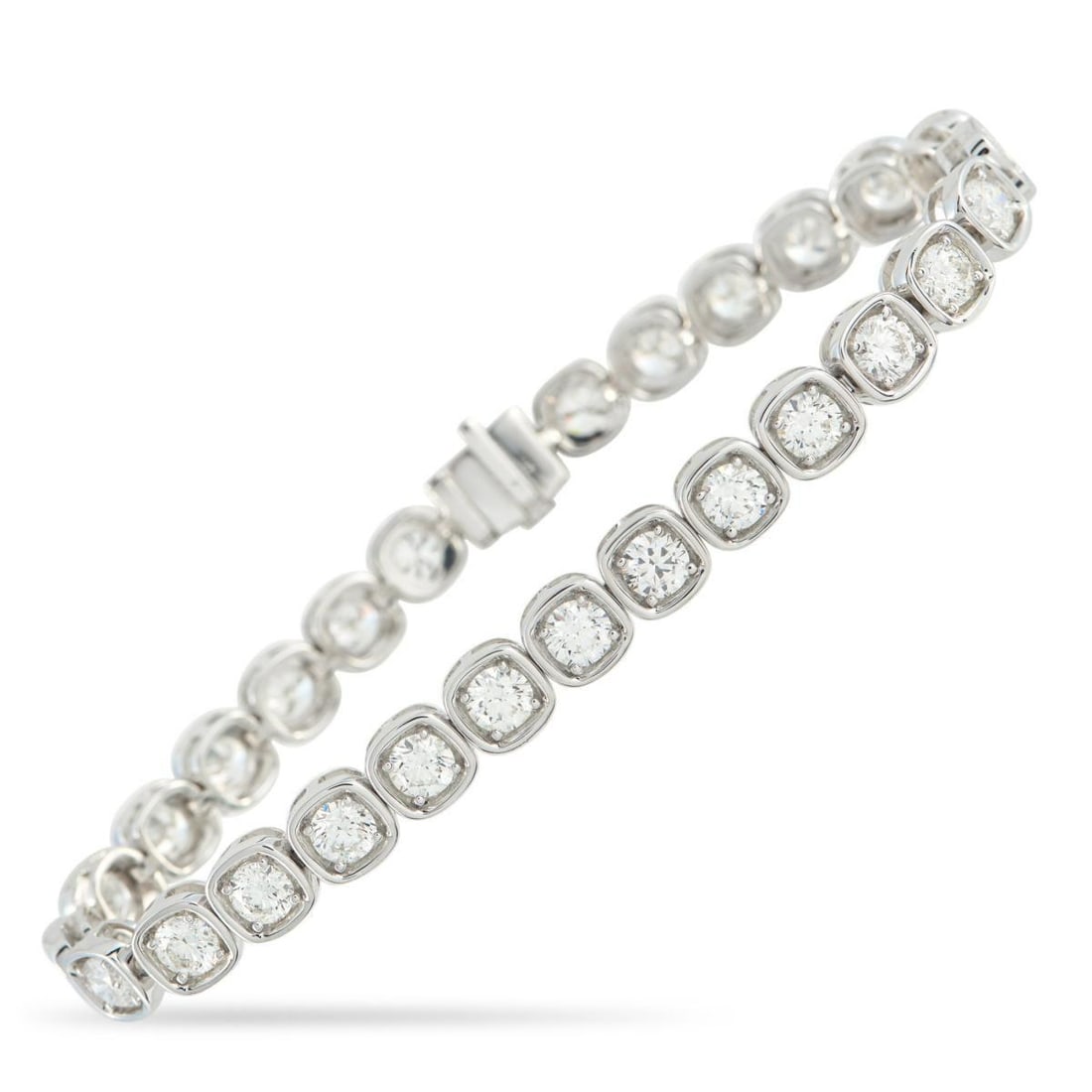 18K WHITE GOLD 8.0CT DIAMOND BRACELET: A bracelet built on contrast. This piece features round diamonds held by four prongs inside cushion-shaped frames. The rounded-square setting gives every stone a defined border without adding height, 
