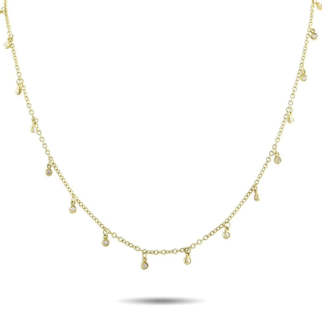 IPPOLITA 18K YELLOW GOLD 1.05CT DIAMOND LONG NECKLACE: Crafted in 18K yellow gold, this Ippolita necklace measures 32 inches long and drapes with graceful fluidity along the neckline. Its delicate chain is accented with evenly spaced bezel-set round diamo