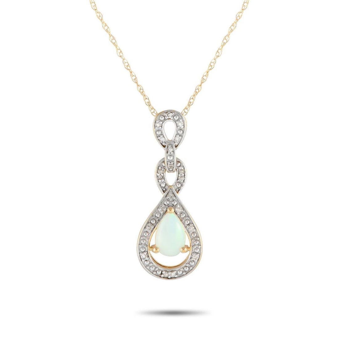 14K YELLOW GOLD 0.08CT DIAMOND AND OPAL NECKLACE: A fiery Opal center stone adds color and dimension to this elegant, understated necklace. On this pieces intricate 14K yellow gold pendant which measures 0.85 long by 0.45 wide additional diamond acce