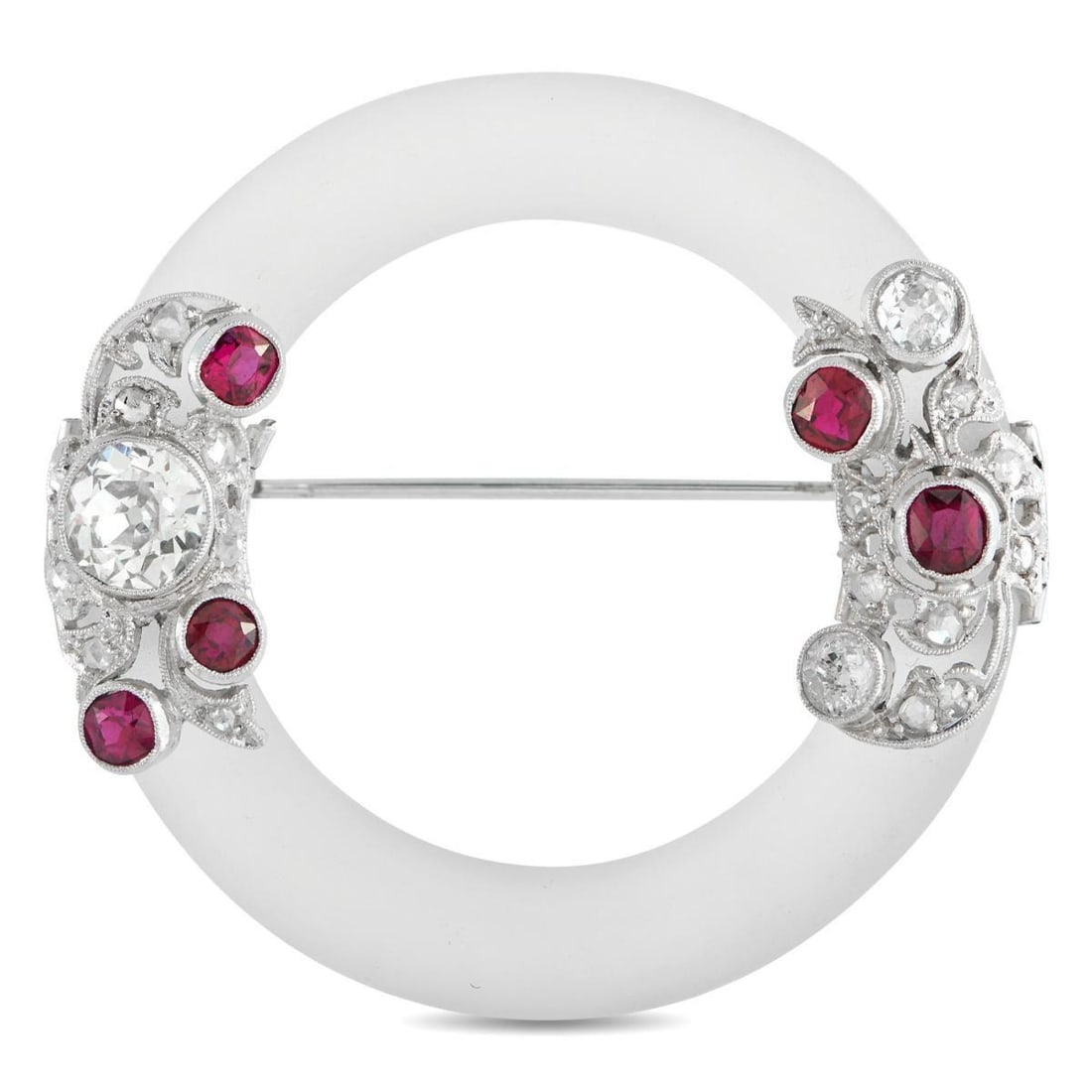 ART DECO 18K WHITE GOLD 1.50CT DIAMOND AND RUBY BROOCH: This Art Deco brooch is unlike anything youve seen before. Crafted from 18K White Gold, filigree metalwork provides this piece with plenty of intricate details. Diamonds totaling 1.50 carats and Ruby 