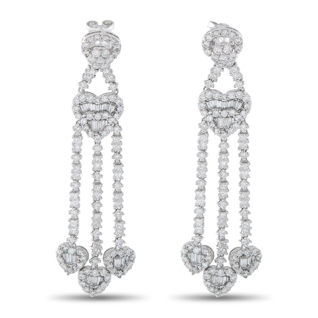 18K WHITE GOLD 3.60CT DIAMOND HEART DROP EARRINGS: Crafted in 18K white gold, these drop earrings are built around a vertical composition of heart-shaped diamond clusters. Each heart combines round and baguette-cut diamonds, arranged to emphasize shap