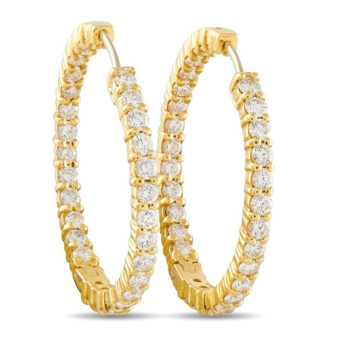 ROBERTO COIN 18K YELLOW GOLD 2.85CT DIAMOND HOOP EARRINGS: These Roberto Coin hoop earrings will add a touch of timeless elegance to any ensemble. The chic inside-out design effortlessly catches the light from every angle thanks to sparkling Diamonds with a t