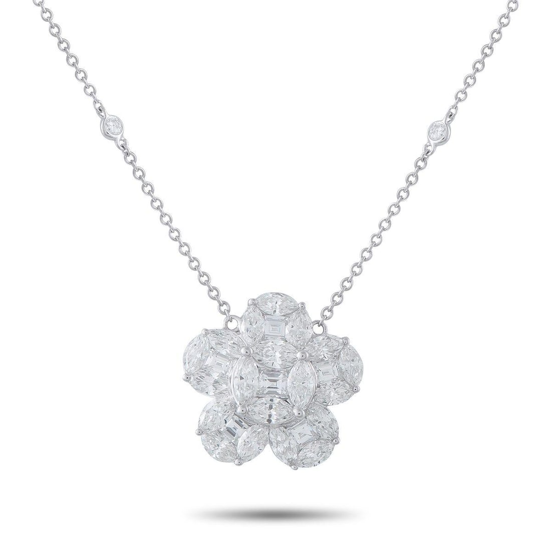 18K WHITE GOLD 4.75CT DIAMOND NECKLACE: A floral pendant covered in sparkling Diamonds totaling 4.75 carats makes this charming necklace a luxurious addition to any ensemble. Crafted from 18K White Gold, the pendant measures 0.75 round and 