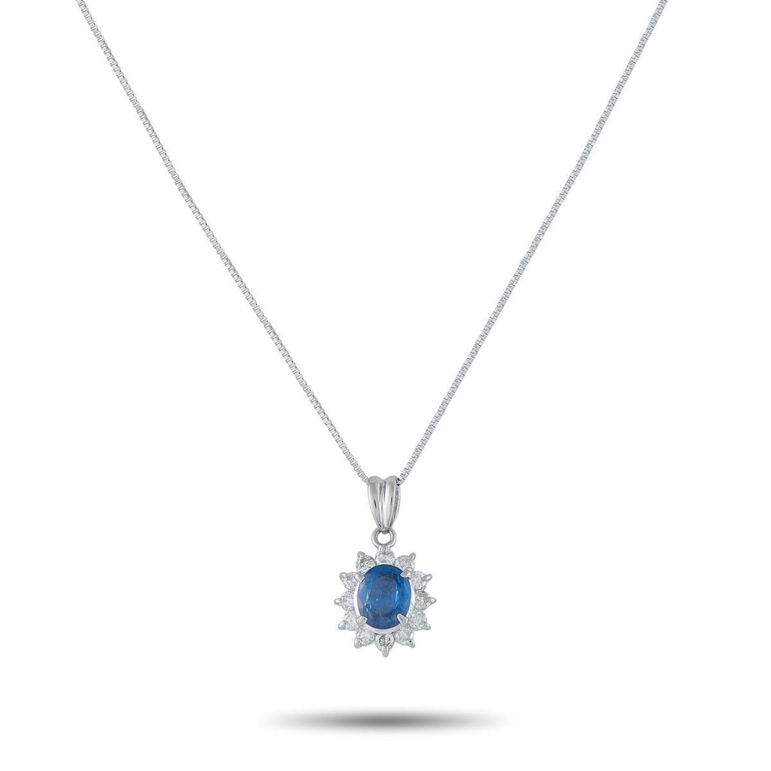 PLATINUM 0.44CT DIAMOND AND SAPPHIRE PENDANT NECKLACE: Add a touch of classic elegance to any ensemble with this timeless necklace. Set in Platinum, it features a 1.15 carat Sapphire center stone surrounded by Diamonds with a total weight of 0.44 carats. 