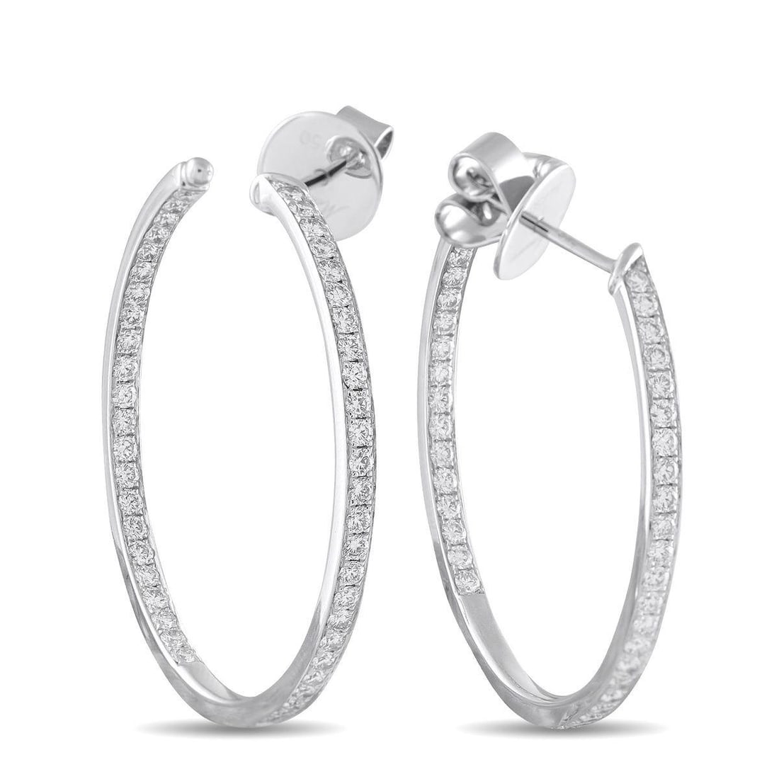 MEMOIRE 18K WHITE GOLD 1.50CT DIAMOND INSIDE-OUT HOOP EARRINGS: These Memoire hoop earrings are simple and incredibly elegant. Diamonds with a total weight of 1.50 carats add a touch of luxury to the understated design. Set in 18K White Gold, each one measures 1.3