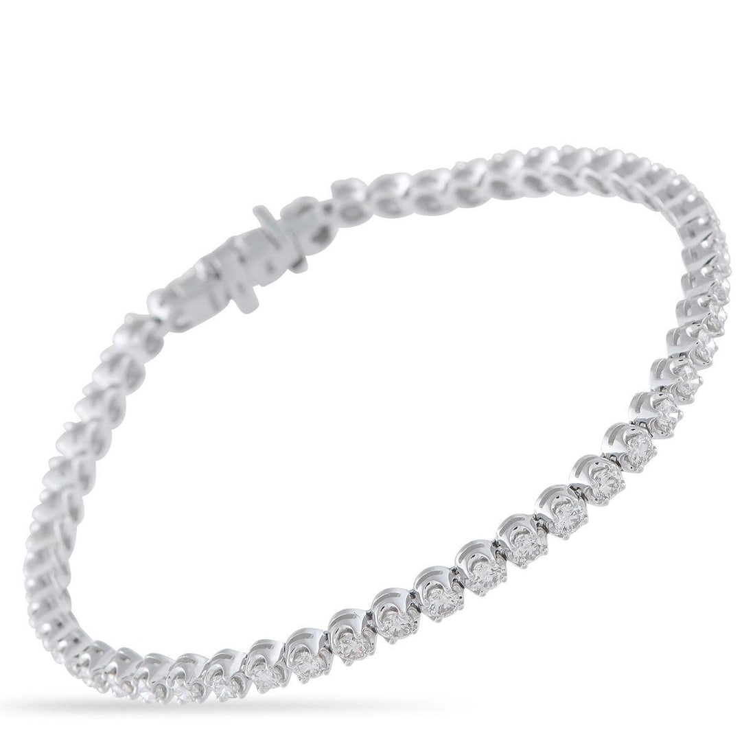 14K WHITE GOLD 2.55CT DIAMOND TENNIS BRACELET: Day or night, this tennis bracelet adapts to any look. It's fashioned in 14K white gold and carries a total of 2.55 carats of diamonds, each set to catch light from every angle. The generous carat
