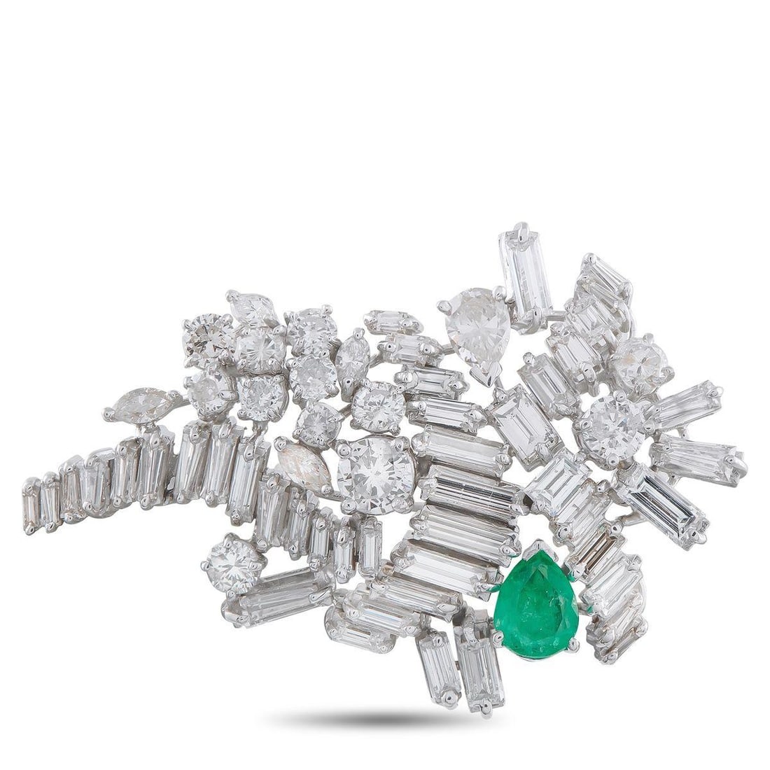 PLATINUM 8.50CT DIAMOND AND EMERALD BROOCH: A contemporary design makes this luxury brooch an exciting addition to any ensemble. Diamonds totaling 8.50 carats add sparkle to the unique Platinum setting. A single 0.85 carat Emerald provides this