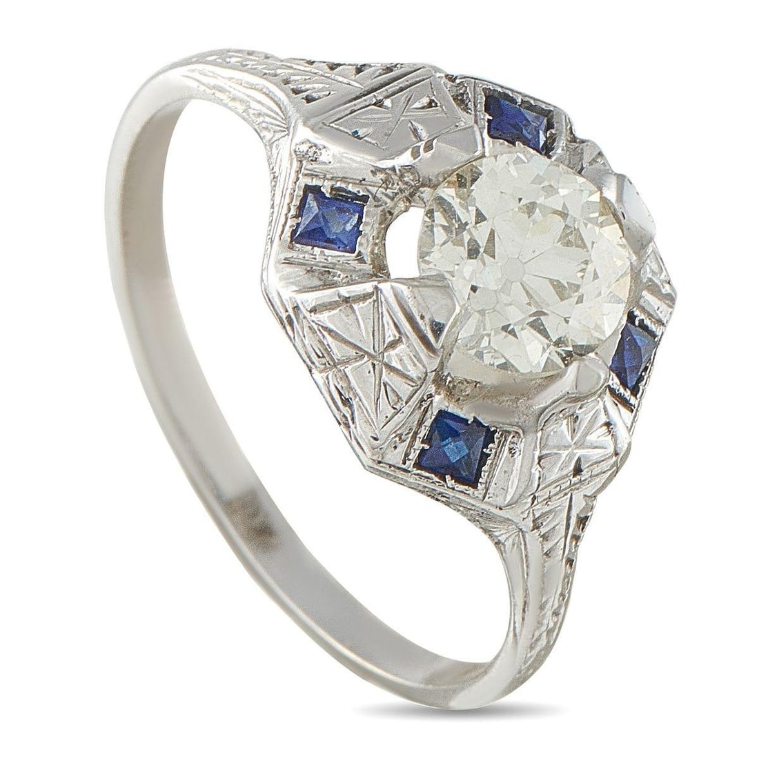18K WHITE GOLD 0.99CT DIAMOND AND SAPPHIRE OCTAGON RING: Light, color, and geometric detail come together in this white gold ring. A 0.99-carat diamond rests on an octagonal base, with four prongs securing it with a sense of suspension. The etched
