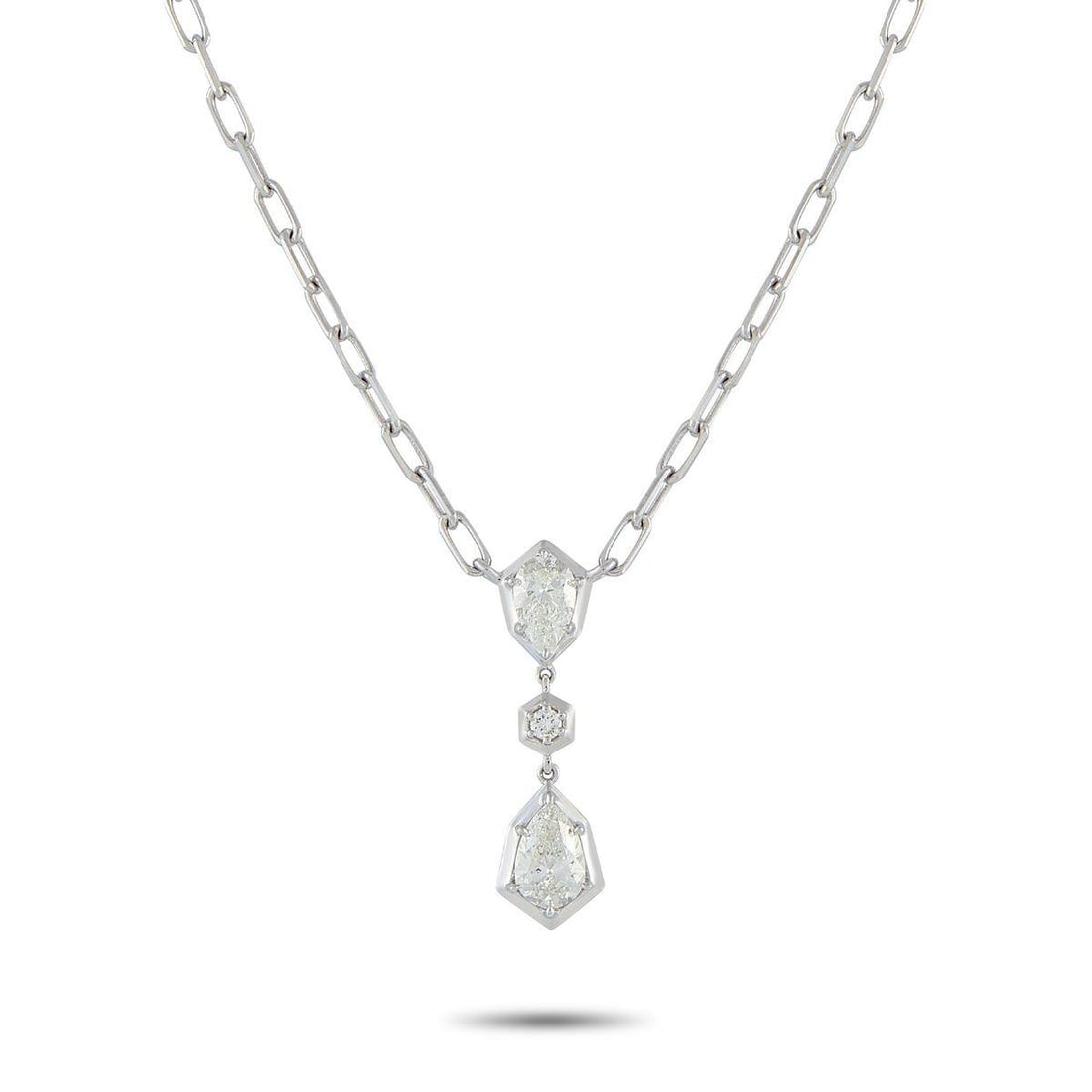 18K WHITE GOLD 1.32 CT DIAMOND NECKLACE: Geometry leads the design, with every stone in this necklace positioned to reinforce its bold look. A pear-shaped diamond, set on four prongs, rests on an angular white gold frame with its pointed end