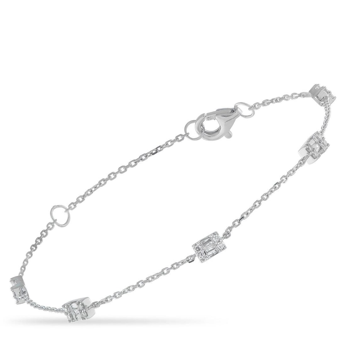 14K WHITE GOLD 0.35CT DIAMOND BRACELET: Diamond clusters with a total weight of 0.35 carats add effortless sparkle to this simple, elegant bracelet. Crafted from 14K White Gold, it measures 6.75 long and comes complete with secure lobster