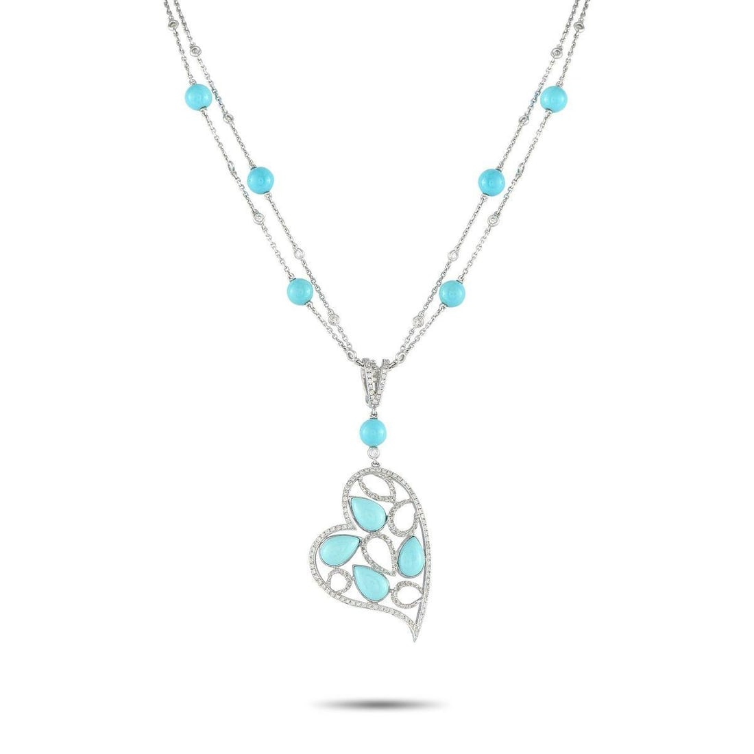 18K WHITE GOLD 1.05CT DIAMOND AND TURQUOISE HEART NECKLACE: Theres something incredibly captivating about this exquisite luxury necklace. Turquoise stones add color to the entire design, while sparkling Diamonds totaling 1.05 carats provide plenty of sparkle. 