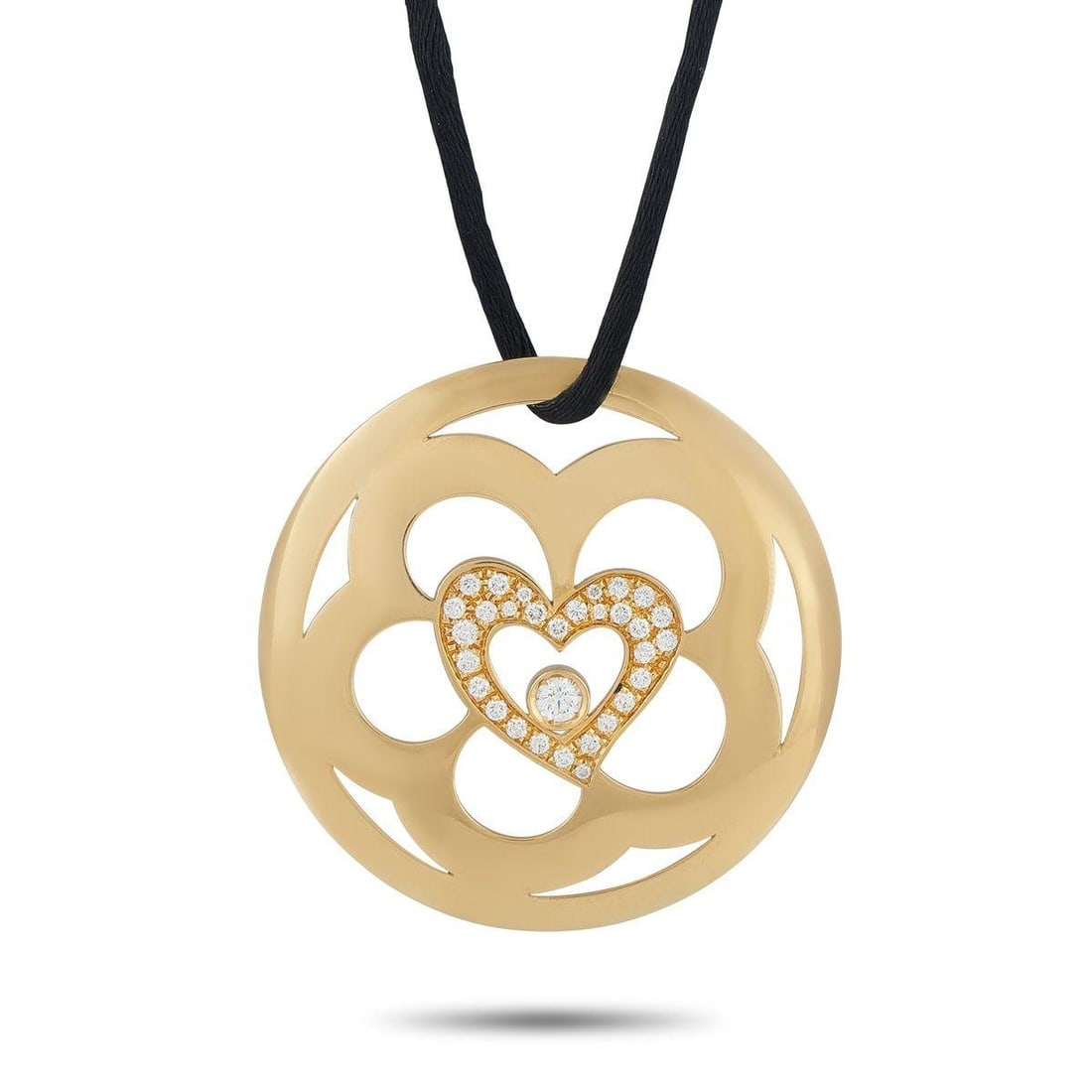 ESCADA 18K YELLOW GOLD 0.75CT DIAMOND PENDANT NECKLACE: This striking Escada necklace is meant to make a statement. Negative space gives the 18K Yellow Gold pendant an artistic sensibility. At the center, a heart motif comes to life thanks to sparkling Dia