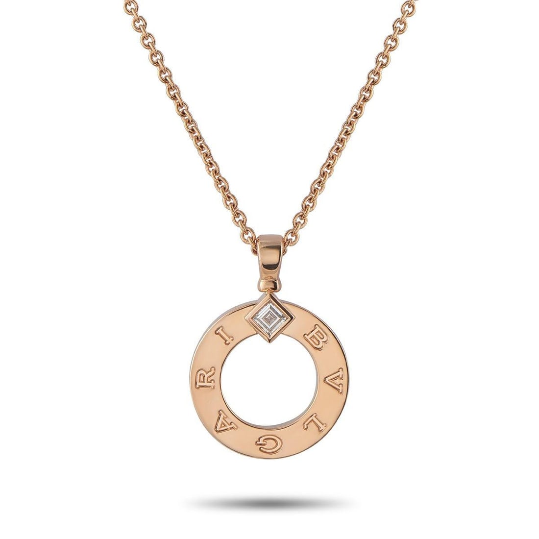 BVLGARI 18K ROSE GOLD DIAMOND PENDANT NECKLACE: On this Bvlgari Bvlgari necklace, the collection's trademark logo evokes the curved inscriptions found on ancient Roman coins. A piece that beautifully blends the past and present, a single carr