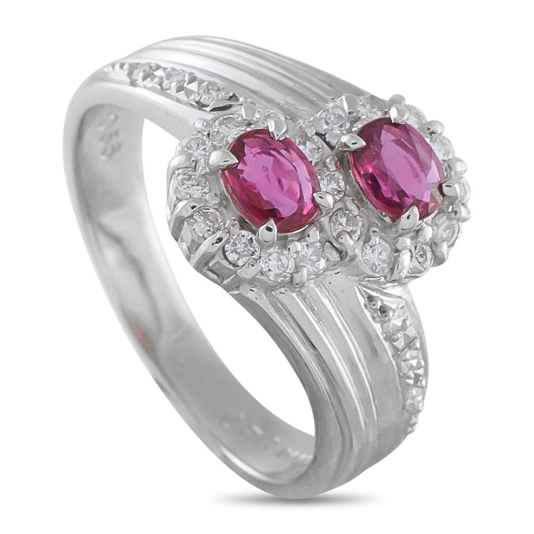PLATINUM 0.27CT DIAMOND AND RUBY RING: A stylish Platinum setting infuses this luxury ring with old fashioned elegance. Sparkling Diamonds with a total weight of 0.27 carats allow it to effortlessly catch the light. A pair of Ruby gemstone