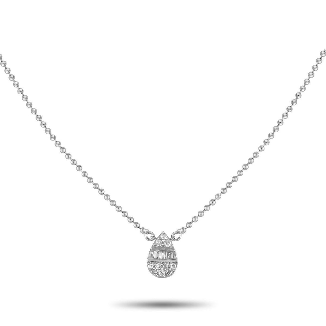 14K WHITE GOLD 0.11CT DIAMOND NECKLACE: You'll find yourself reaching for this necklace daily. Crafted for comfort and versatility, it features a fine and lightweight ball chain holding a pear-shaped cluster pendant of round and baguette