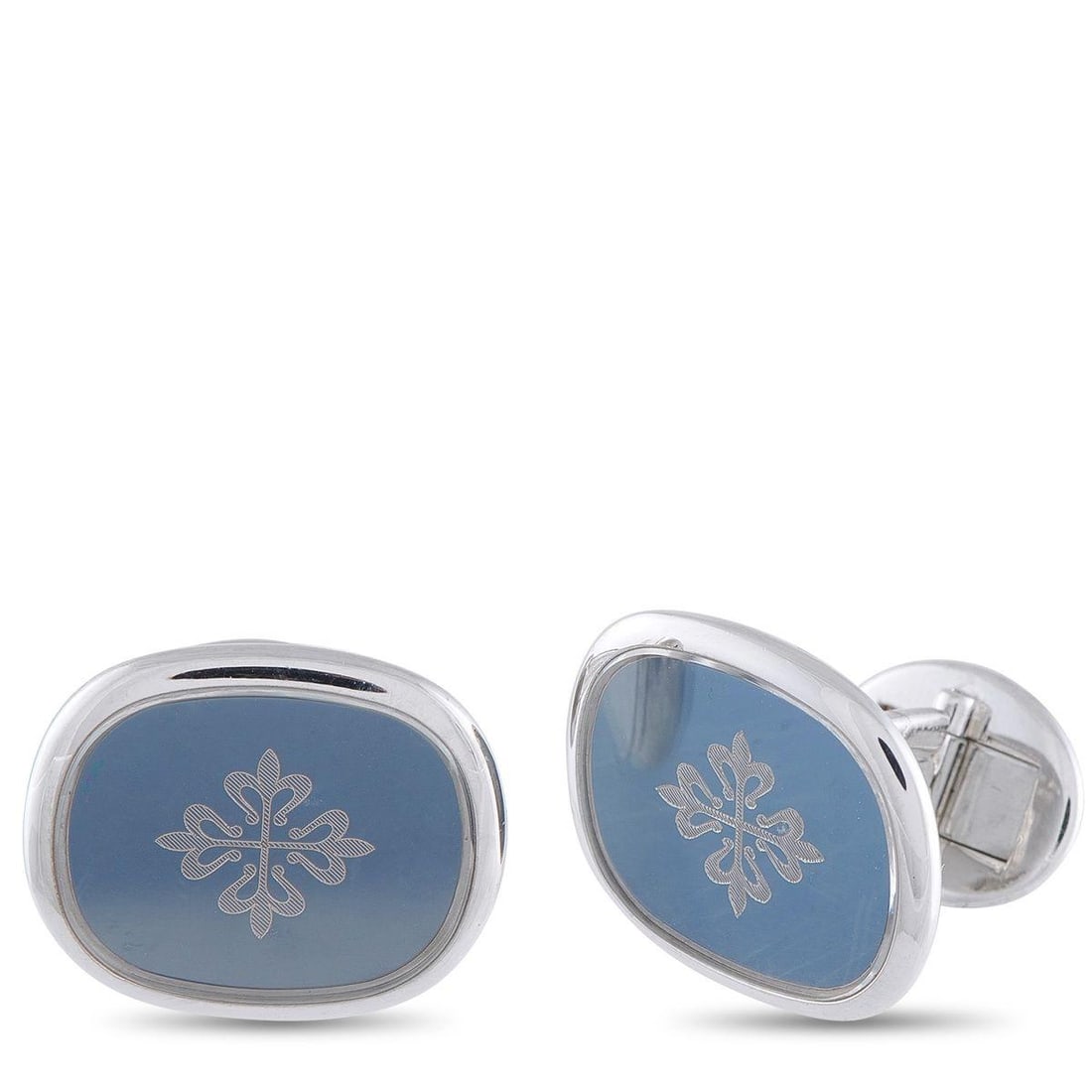 PATEK PHILIPPE 18K WHITE GOLD CALATRAVA CROSS CUFFLINKS: These Patek Philippe cufflinks are undeniably sophisticated. At the center of the 18K White Gold setting, youll find the brands iconic Calatrava Cross in a field of blue. Each one measures 0.75 long