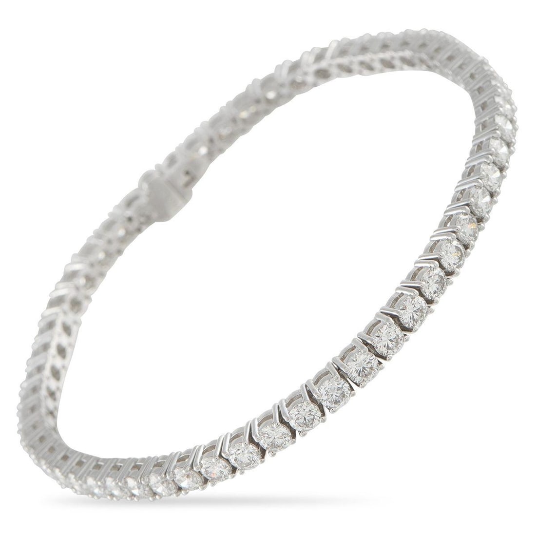 18K WHITE GOLD 6.91CT DIAMOND TENNIS BRACELET: A classically elegant design makes this tennis bracelet an essential addition to any jewelry collection. Set in 18K White Gold, Diamonds with a total weight of 6.91 carats provide endless sparkle. It