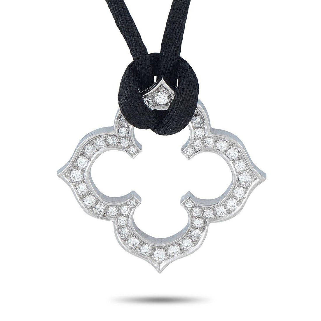 CARTIER QUATREFOIL 18K WHITE GOLD DIAMOND PENDANT NECKLACE: This Cartier Quatrefoil necklace is beautifully balanced. The 18K White Gold pendant measures 1.19 round and comes to life thanks to sparkling inset Diamonds. A 20 black cord allows you to dress it up