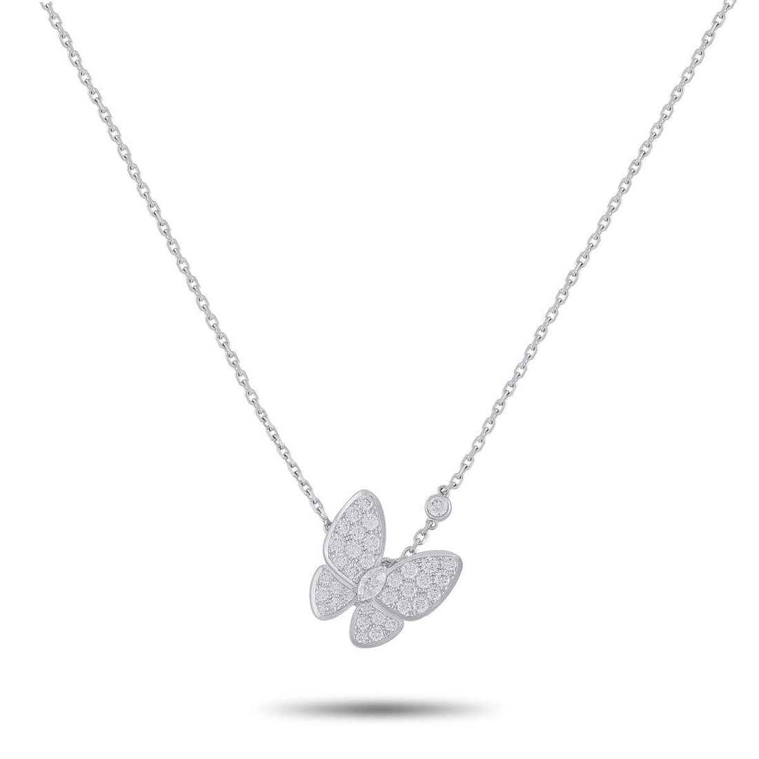 VAN CLEEF & ARPELS TWO BUTTERFLY 18K WHITE GOLD 0.88CT DIAMOND NECKLACE: An elegant, airy design makes this Van Cleef & Arpels Two Butterfly necklace instantly captivating. Covered in Diamonds totaling 0.88 carats, this exquisite accessory features an asymmetrical design t
