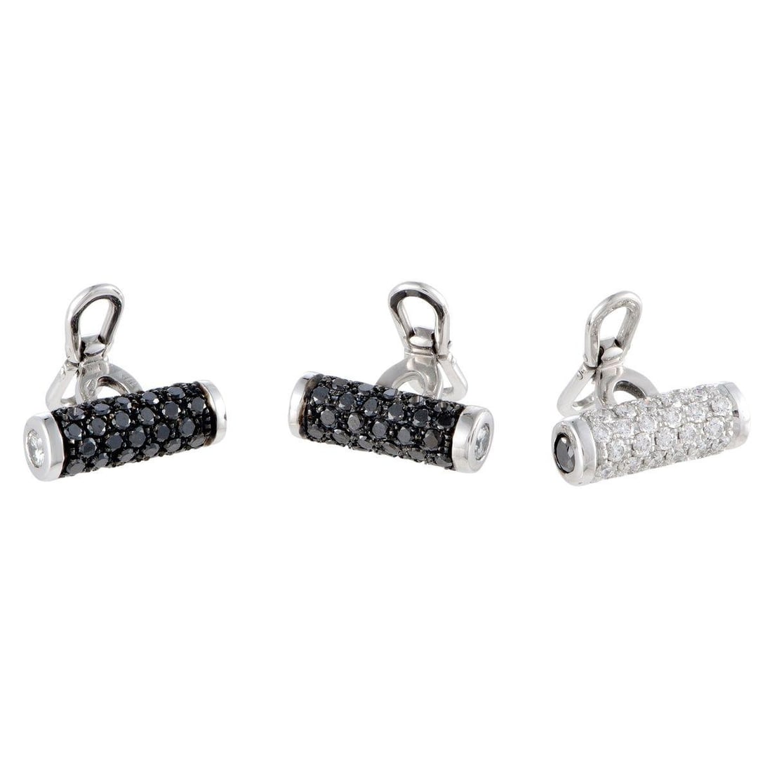 DE GRISOGONO ACCESSOIRE 18K WHITE GOLD FULL WHITE AND BLACK DIAMONDS TUXEDO TOGGLE BUTTONS SET: These exceptional tuxedo buttons are designed in a remarkably elegant manner, and the refined design is luxuriously topped off with incredibly resplendent gemstones. The buttons are presented by de Gr