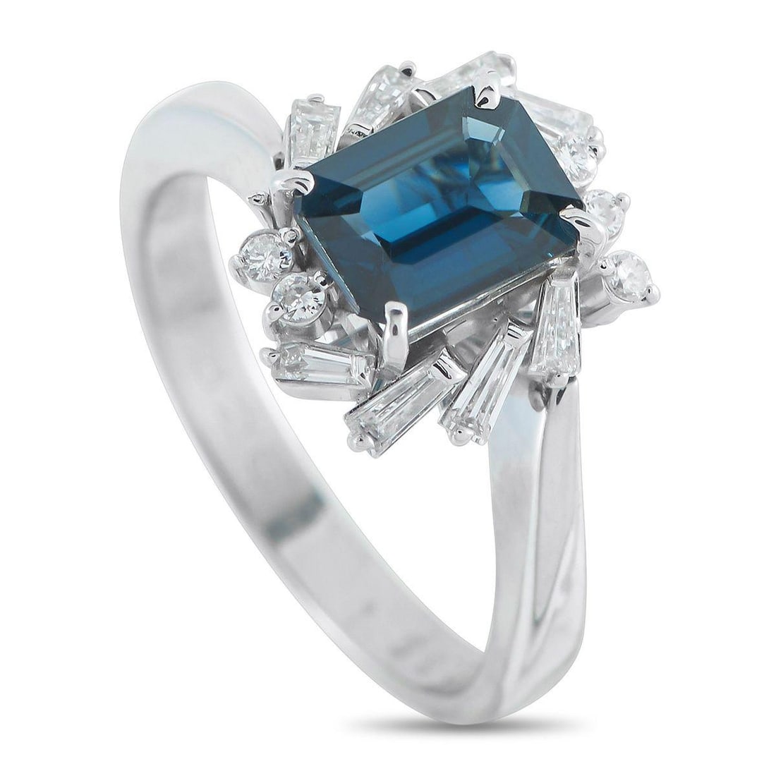 PLATINUM 0.35CT DIAMOND AND SAPPHIRE RING: A captivating 1.34 carat Sapphire gemstone makes this luxury piece an exciting addition to any collection. Set in Platinum, a creative halo of Diamonds totaling 0.35 carats add extra sparkle and visua