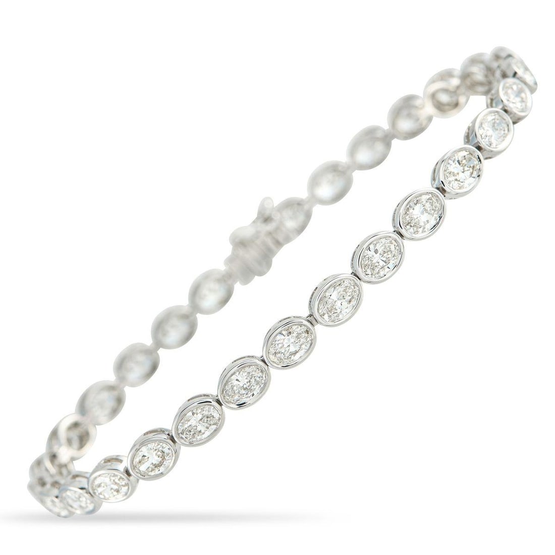 18K WHITE GOLD 7.25CT DIAMOND BRACELET: A series of sparkling Diamonds with a total weight of 7.25 carats makes this bracelet simply unforgettable. Simple, elegant, and perfectly understated, its crafted from 18K White Gold and measures 7.0