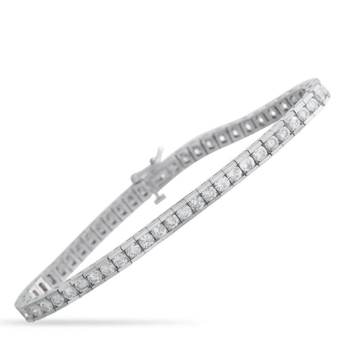 14K WHITE GOLD 5.60CT DIAMOND TENNIS BRACELET: Channel set Diamonds with a total weight of 5.60 carats make this tennis bracelet incredibly elegant. Sleek and stylish, the understated 14K White Gold setting allows it to effortlessly complement any