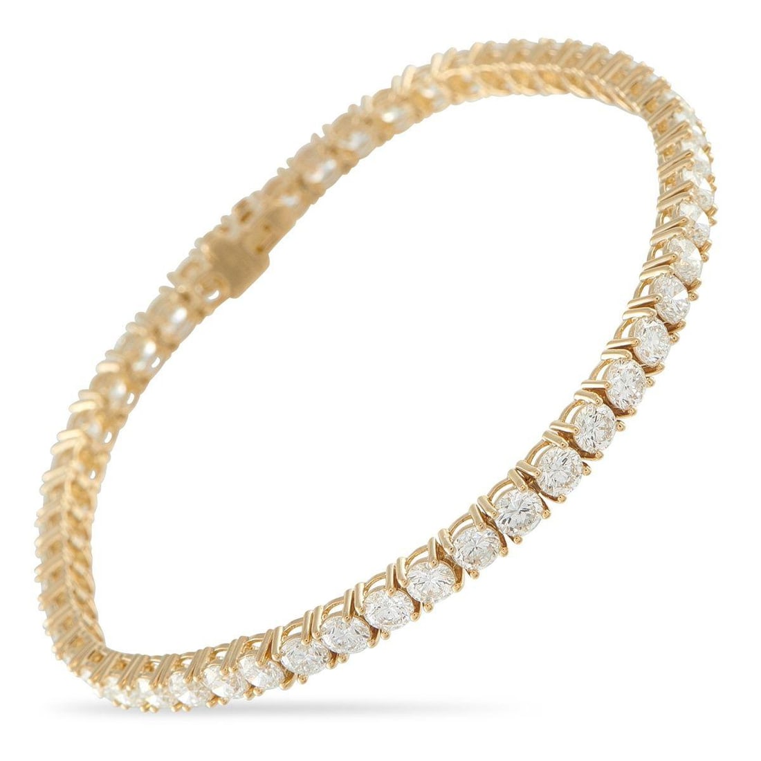 18K YELLOW GOLD 8.44CT DIAMOND TENNIS BRACELET: This classic tennis bracelet will never go out of style. On this elegant piece, sparkling Diamonds totaling 8.44 carats contrast against the opulent 18K Yellow Gold setting. It measures 7.5 long and i
