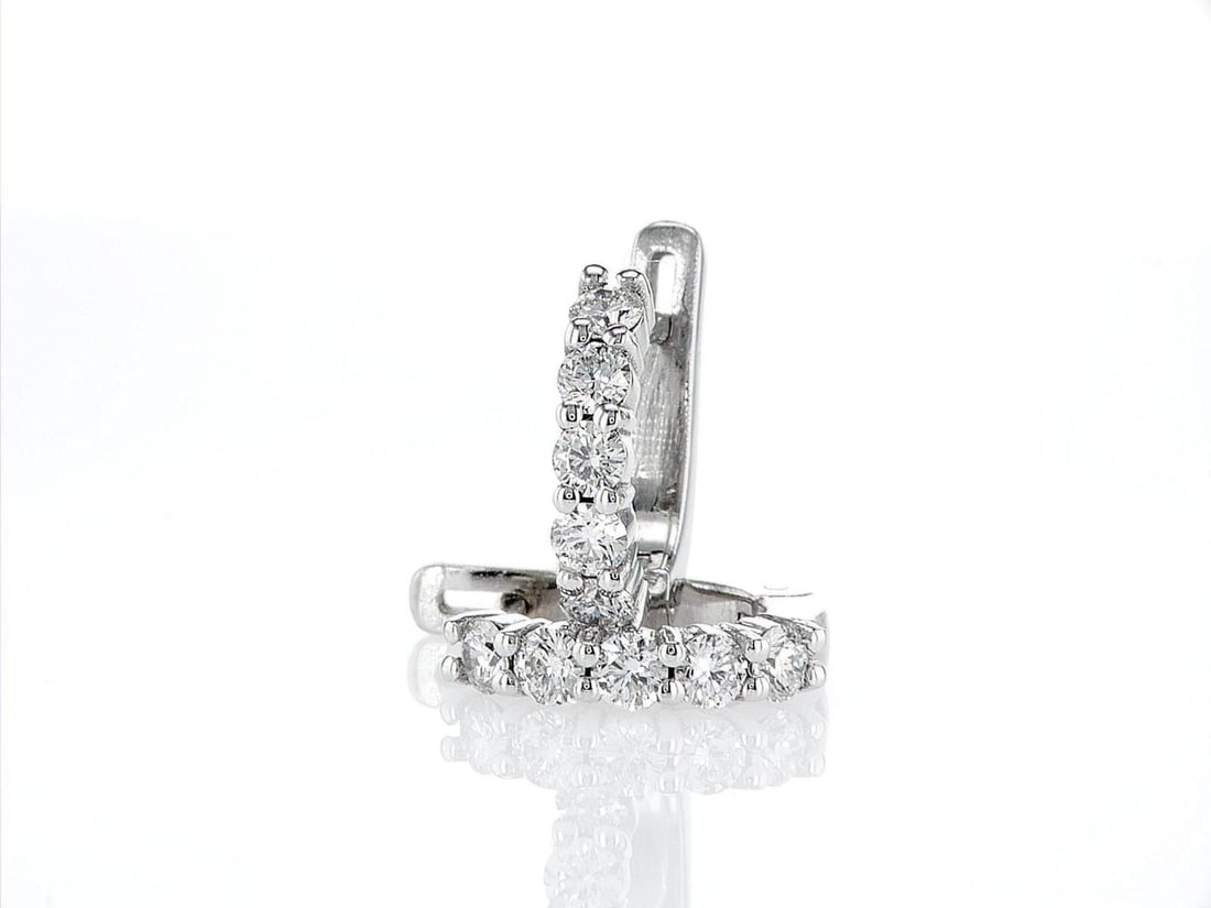 14kt White Gold 0.68ctw Diamond Earrings: One pair of 14k white gold earrings (14k stamped), each set with natural diamonds. Jewelry Weight: 3.29Grs Total Diamonds Weight: 0.68Cts Main Stones Description: Cut and shape: Round Brilliant Carats