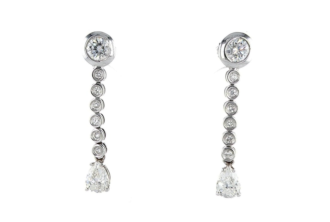 14kt White Gold 3.2ctw Diamond Earrings: One pair of 14k white gold earrings (14k stamped), each set with natural diamonds. Jewelry Weight: 5.91Grs Total Diamonds Weight: 3.2Cts Main Stones Description: Quantity: 16 Cut and shape: Pear & Rou